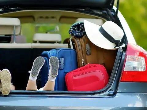 Bags and Kids in Trunk of Car; Courtesy of MN Studio/Shutterstock.com