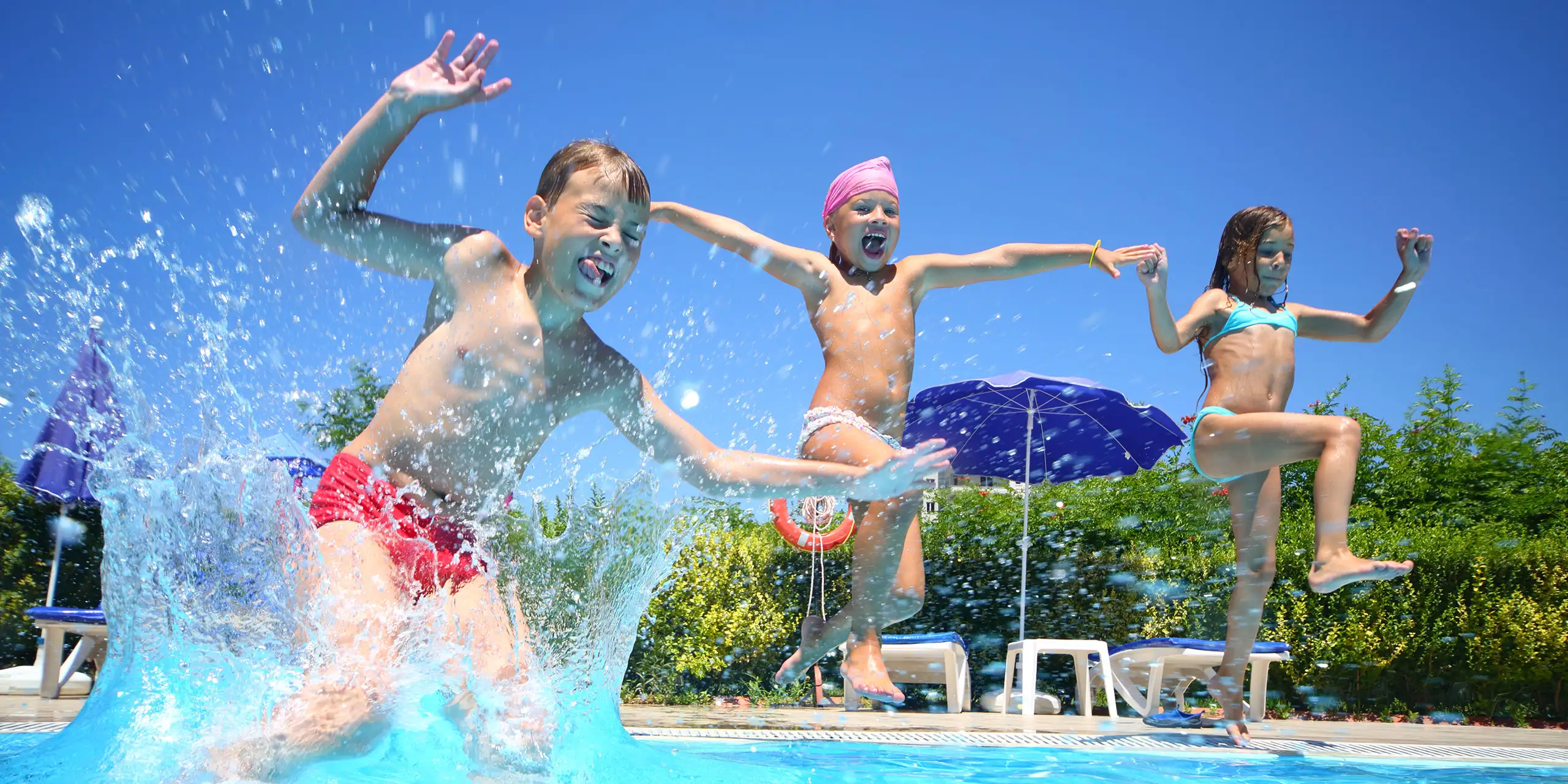 Kids Jumping in Pool; Courtesy of Pavel L Photo and Video/Shutterstock.com