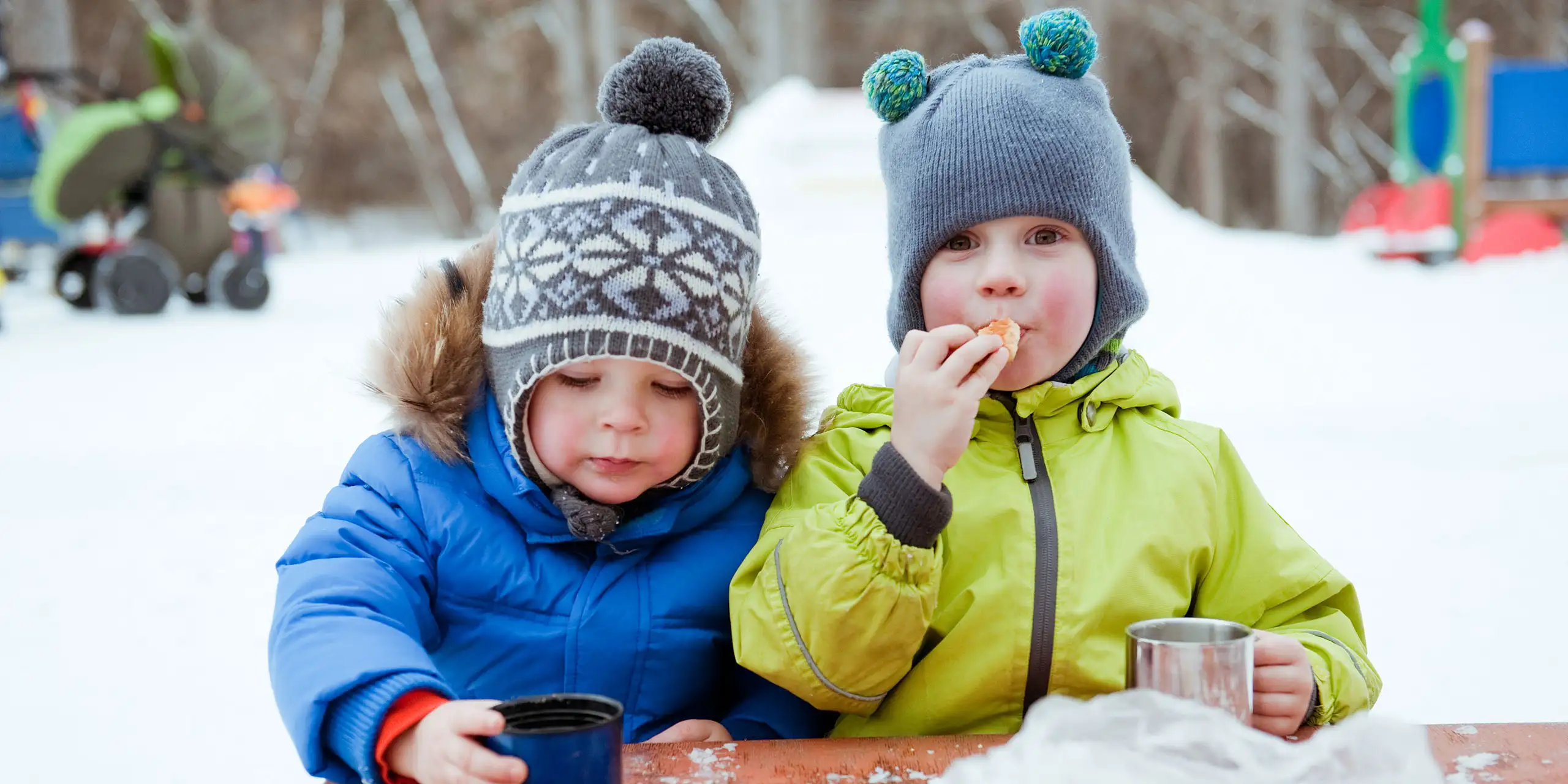 Little Boys Sipping Hot Cocoa; Courtesy of mamaza/Shutterstock.com