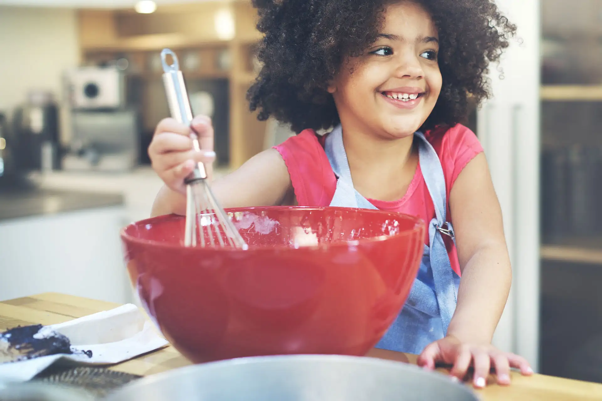 Little Girl Mixing Food; Courtesy of Rawpixel.com/Shutterstock.com