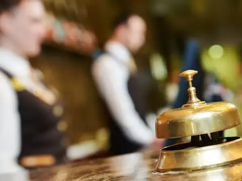Hotel Check-In; Courtesy of Dmitry Kalinovsky/Shutterstock.com
