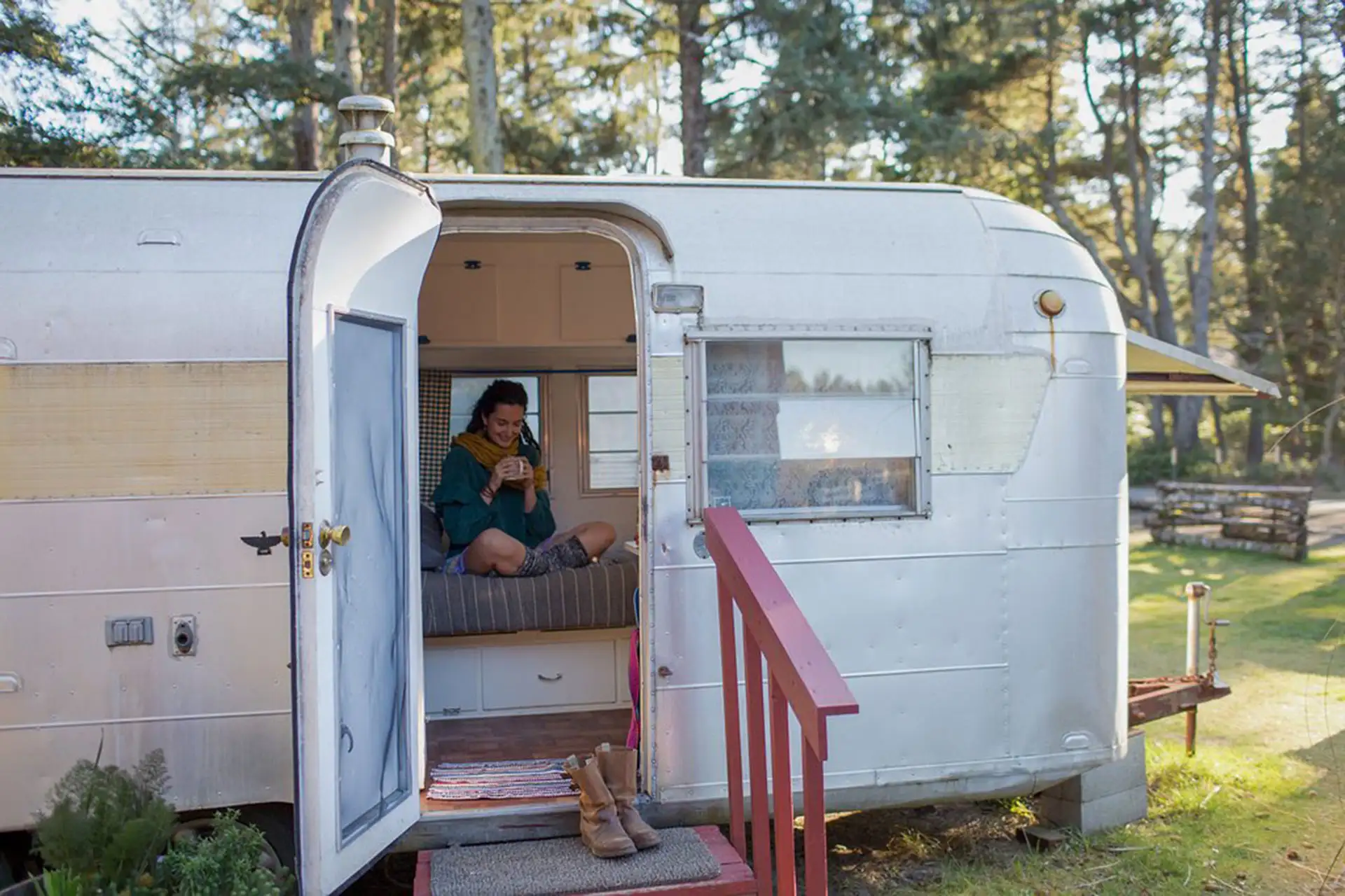 Teenage Girl in Airstream Trailer at Sou’wester Historic Lodge and Vintage Travel Trailer Resort in Seaview, Washington