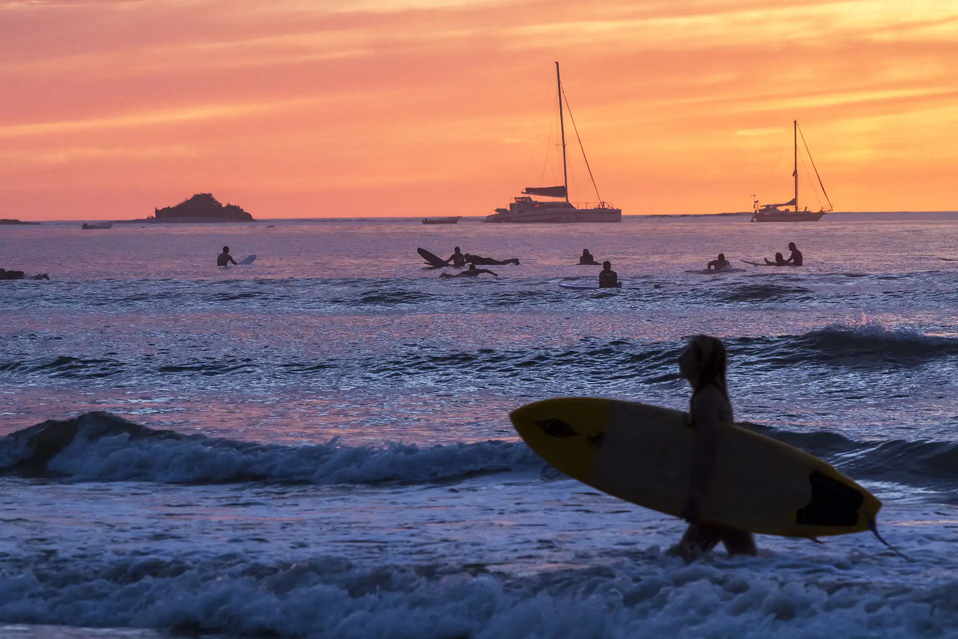 Surfing in Tamarindo, Costa Rica; Courtesy of Colin D. Young/Shutterstock.com