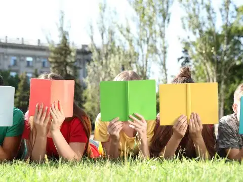 Teens Reading Books; Courtesy of Africa Studio/Shutterstock.com