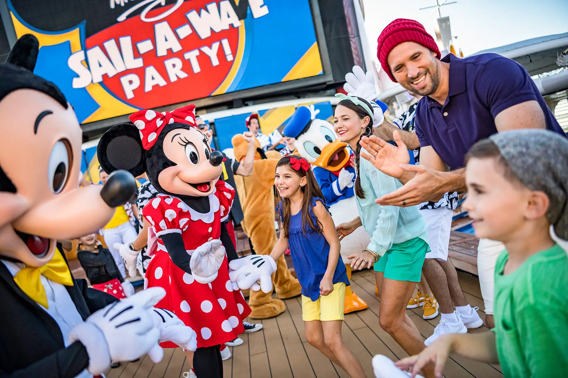 During Mickey’s Sail-a-Wave Party aboard the Disney Magic and Disney Wonder, guests join Mickey, Minnie, Goofy, Pluto and Donald; Courtesy of Disney