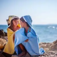 kids wearing beach towels; Courtesy of Kristina Zhuravleva/Shutterstock