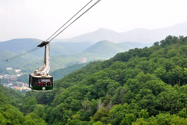Tourists riding the scenic gondola cable car at Ober Gatlinburg in Tennessee; Courtesy of David Carillet/Shutterstock