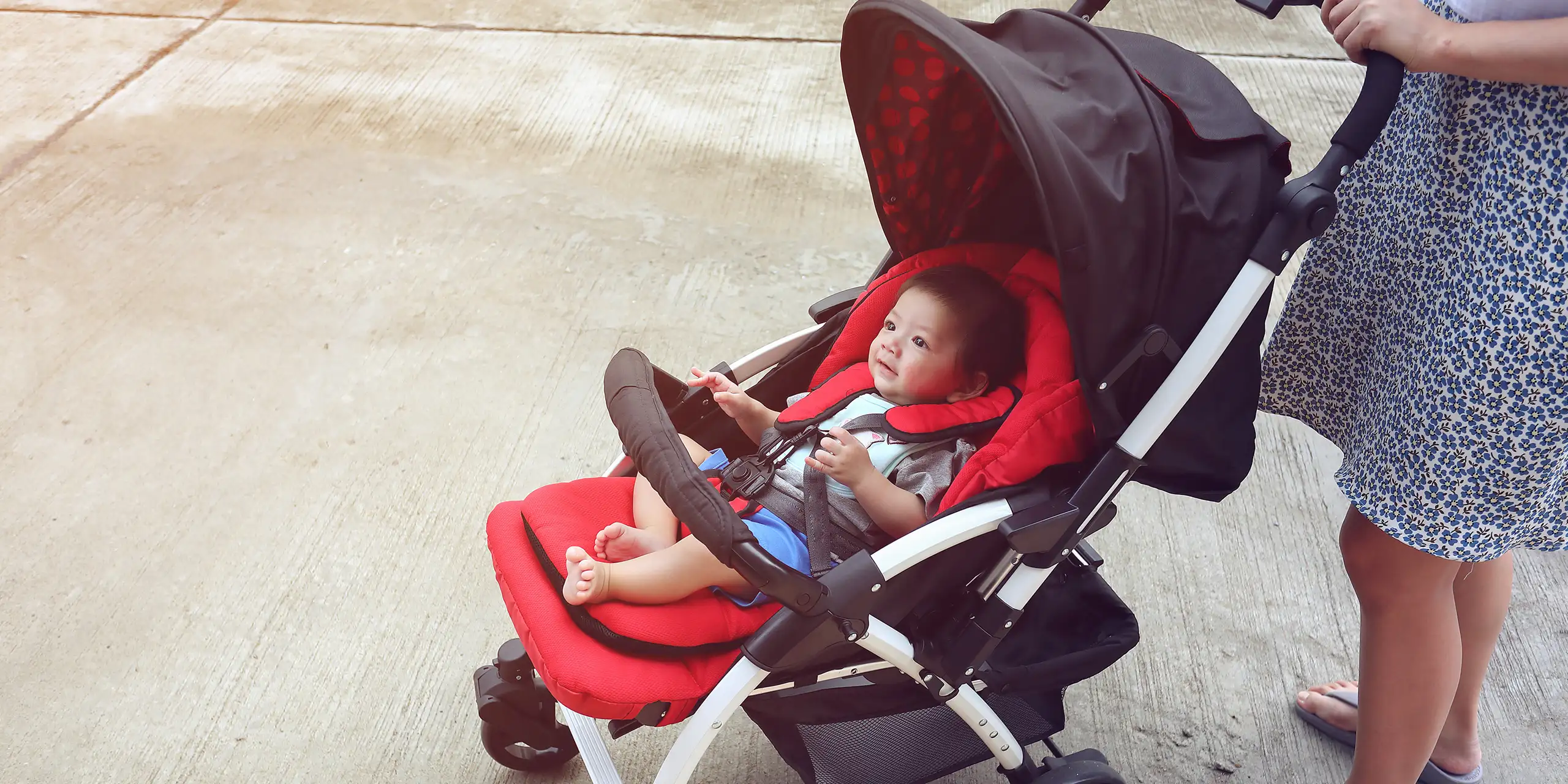 mom in a red stroller; Courtesy of Shutterstock