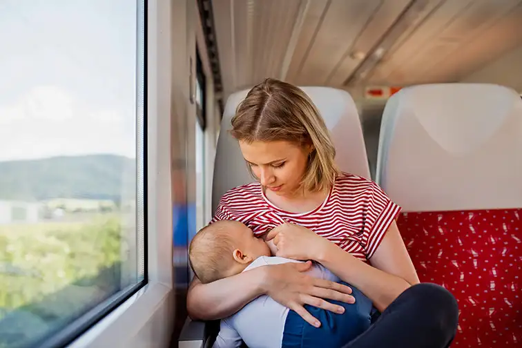 baby train travel nursing; Courtesy of halfpoint/Shutterstock
