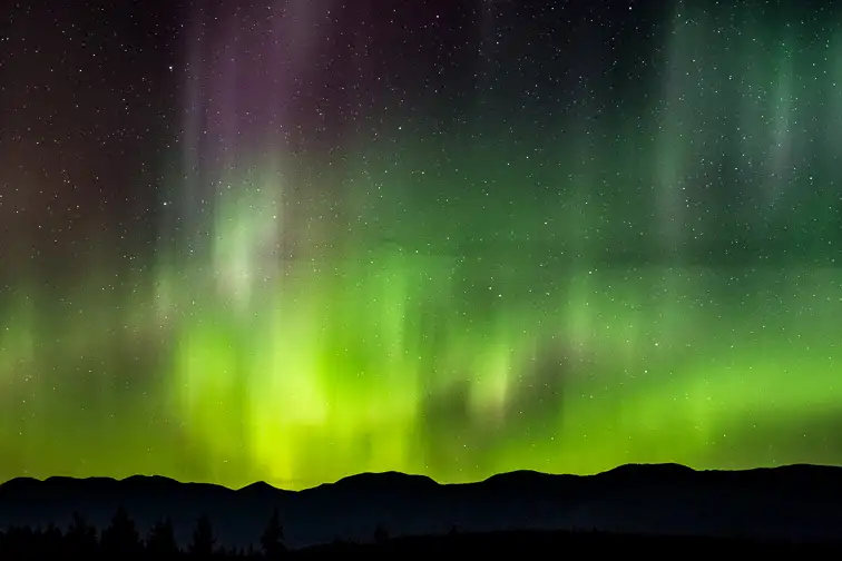 The Northern Lights over the Whitefish Mountain Range, Montana.; Courtesy of Zach Tanz/Shutterstock
