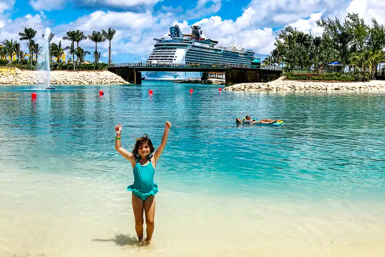 little girl standing in front of cruise ship in port; Courtesy of Cortney Fries