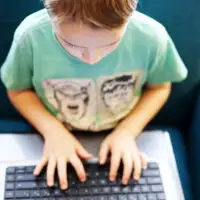 Boy playing on laptop; Courtesy of Twenty20