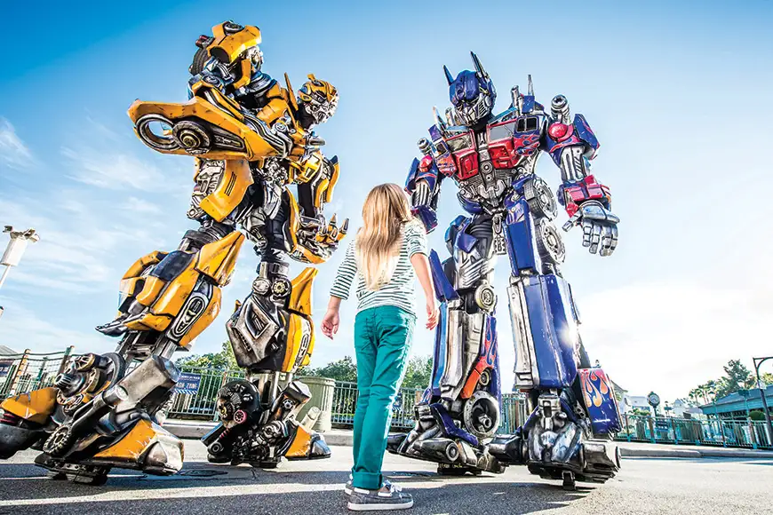 Optimus Prime, leader of the Autobots, and Bumblebee make in-park appearances at Universal Studios Florida.; Courtesy Universal Studios