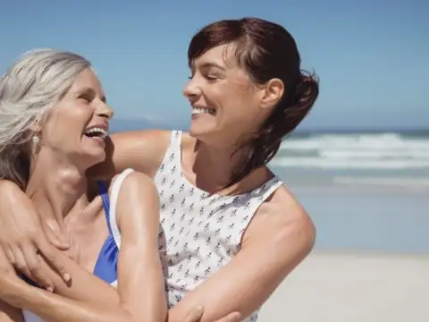 Woman with daughter on beach