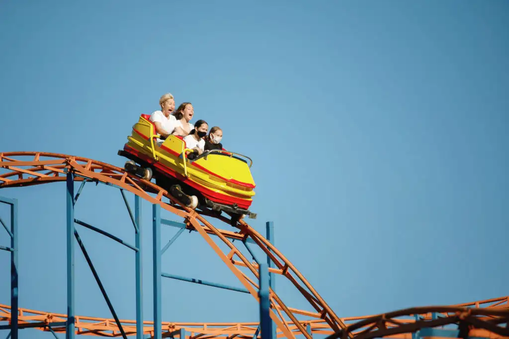 Four people riding a roller coaster