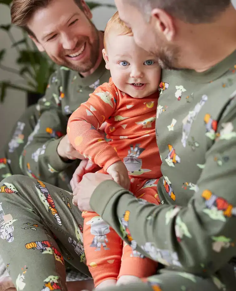 Two men and baby wearing Hanna Anderson Star Wars Halloween Matching Family Pajamas​
