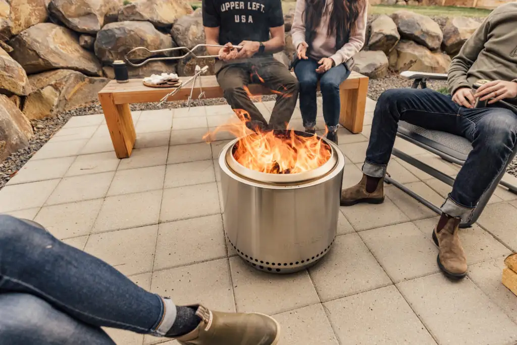 Friends sitting around the Solo Stove Bonfire